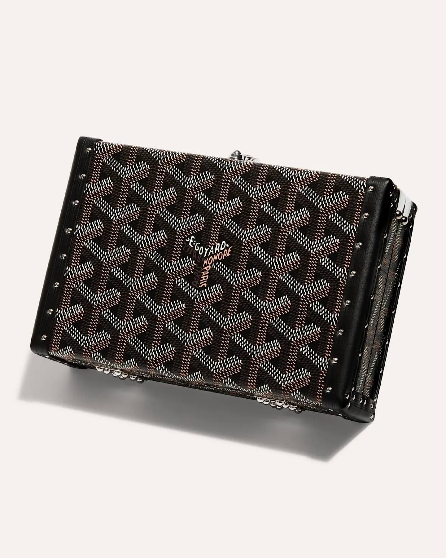 Goyard Minaudière Trunk Bag in black and grey Goyardine canvas with palladium hardware, leather trim, detachable shoulder strap, and signature trunk-inspired design.
