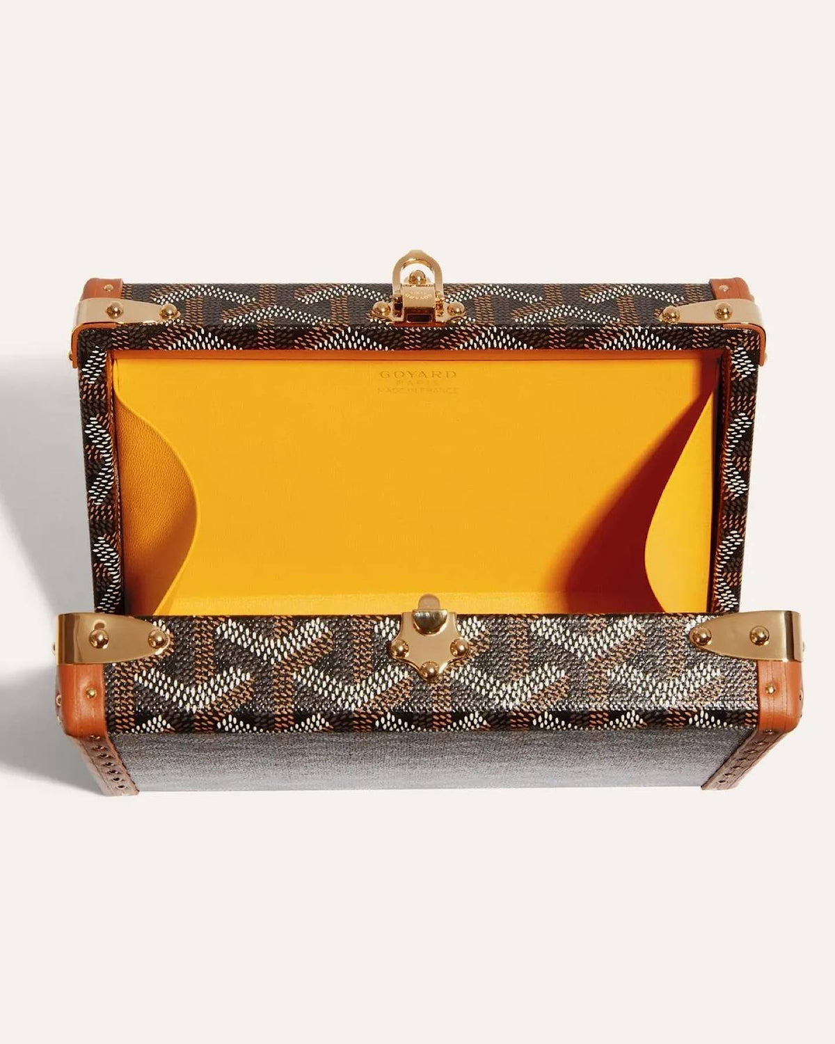 Goyard Minaudière Trunk Bag in signature Goyardine canvas with leather trim and palladium hardware, featuring a structured trunk silhouette and detachable shoulder strap.