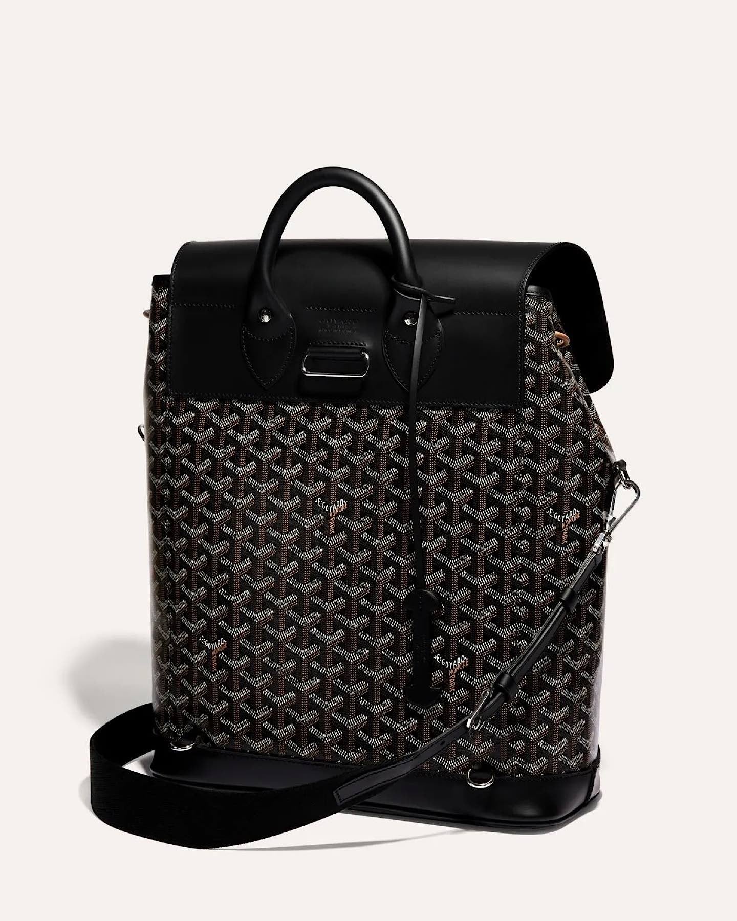 Rear view of the Goyard Alpin MM Backpack featuring signature Goyardine canvas and leather details.
