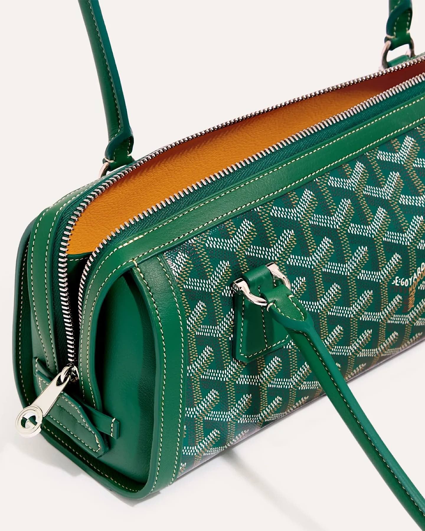 Close-up of the Goyard Bonbonniere Bag Green showing the signature Goyardine canvas, leather handles and silver-tone zipper hardware.